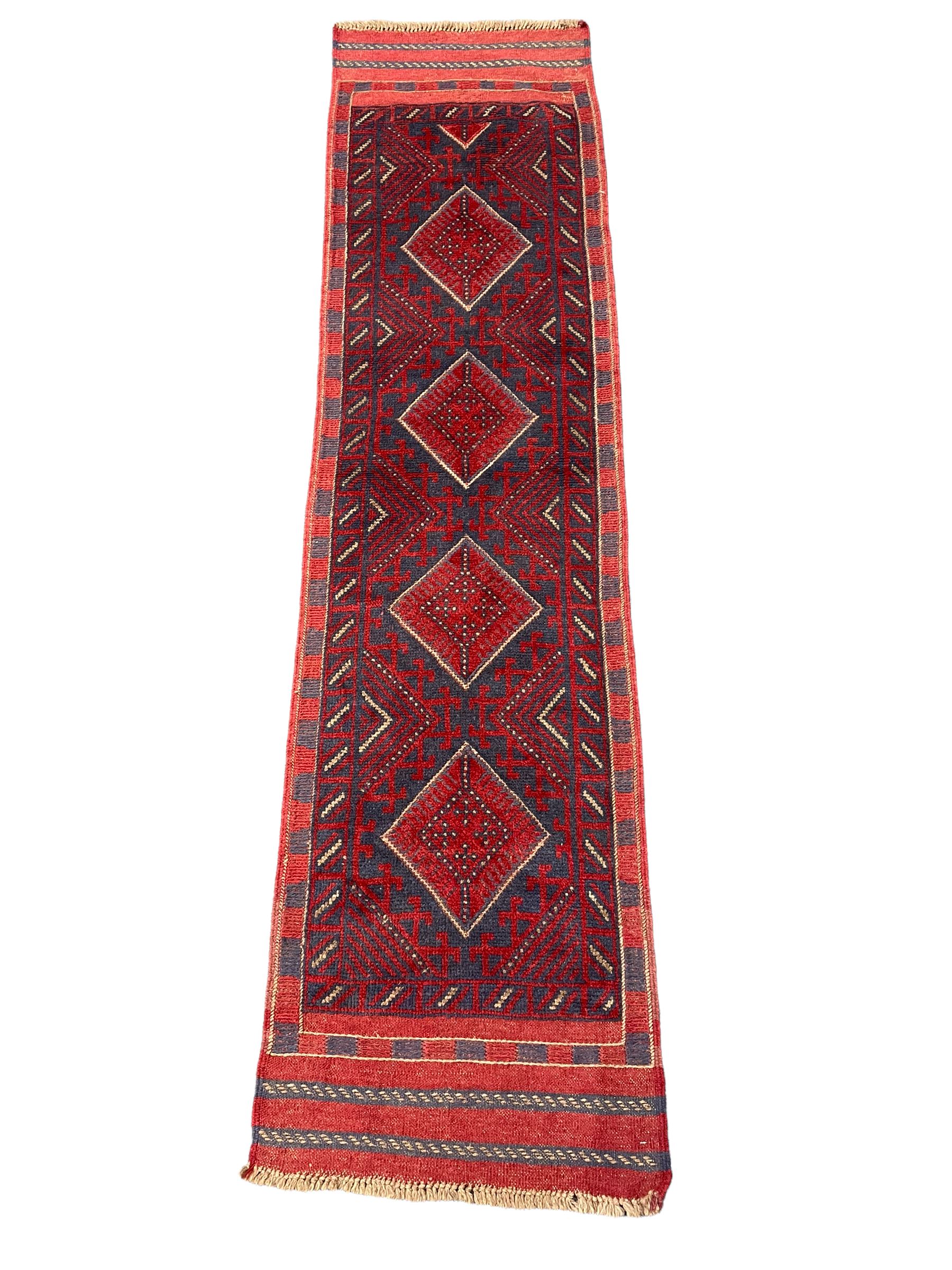 Meshwani red and blue ground runner, four lozenge medallions, overall geometric design 