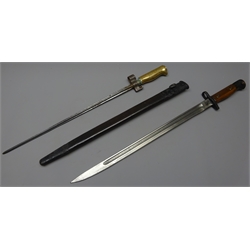  WWl Bayonet with 43cm single edge fullered blade, ricasso stamped Crowned GR over 1907, Wilkinson, Crows foot over Crowned V, wooden slab grip with stud, L55.5cm, in leather & steel scabbard and a French Epee type Bayonet, 39cm cross blade stamped B G, cross stamped E34069, brass grip, L51cm (2)   