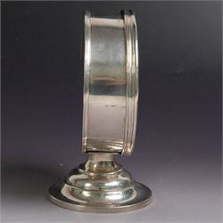 Late Victorian silver lunette, of plain circular form with hinged cover opening to reveal gilt interior, upon a circular domed foot, hallmarked Lambert & Co, London 1897, H13cm