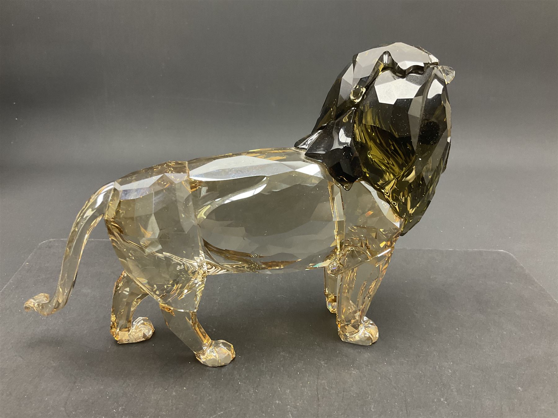 Swarovski Crystal lion, Akili, together with small Swarovski Crystal plaque with lion silhouette, H13cm