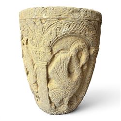 Cast stone Romanesque design urn of tapering form, decorated in relief with motifs of zoomorphic figures and swans within foliate and guilloche cast architectural arches with Neoclassical columns, in weathered finish
