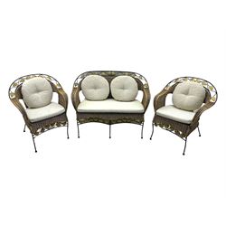 Late 20th century three-piece garden suite, wicker construction and wrought iron frame, decorated with cast metal leaf motifs, cream seat cushions and round back cushions