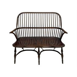 Traditional elm and oak two seat Windsor bench, high comb and stick back, double dished seat on turned supports joined by two crinoline stretchers