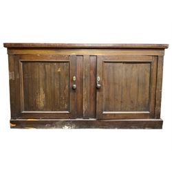 19th century mahogany sideboard, enclosed by two panelled doors, on plinth base