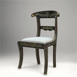 Early 20th century Anglo-Indian painted and inlaid armchairs, each with shaped top rail decorated with polychrome floral motifs above turned spindle galleries, shaped open arms and upholstered seats, on square supports with similar painted decoration
