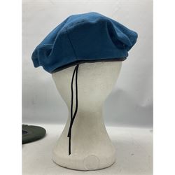 Four paratrooper berets - Russian, Italian, British and Foreign Legion; all with badges (4)