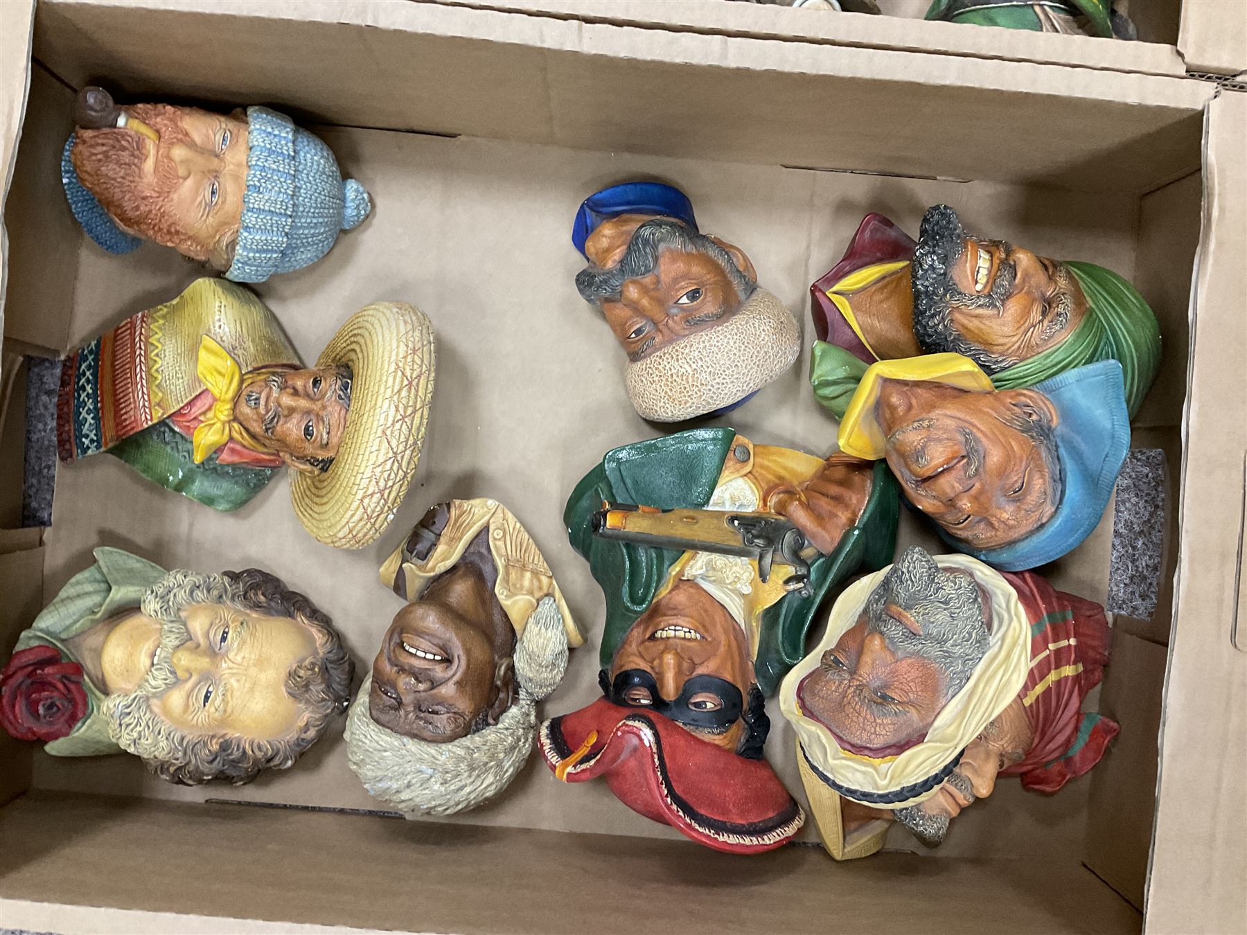 Large collection of Bossons plaster wall-masks, including including fisher man, policeman, highway man, etc, in four boxes 