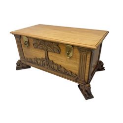 India camphor wood blanket box, moulded hinged lid, decorated with carved elephants and trees, on elephant carved feet