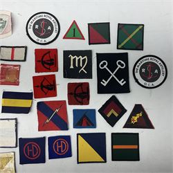 Approximately one-hundred printed and embroidered cloth badges including 3rd Indian Infantry, Chindits Hermes Wings, 6th Field Force, 1st & 2nd Army Group RA, HQ Land Forces Persian Gulf, Home Counties District, Eastern Command, Anti-Aircraft Command, 1st Anti-Aircraft Division, 51st Highland, 53rd Welsh and 4th Infantry divisions etc