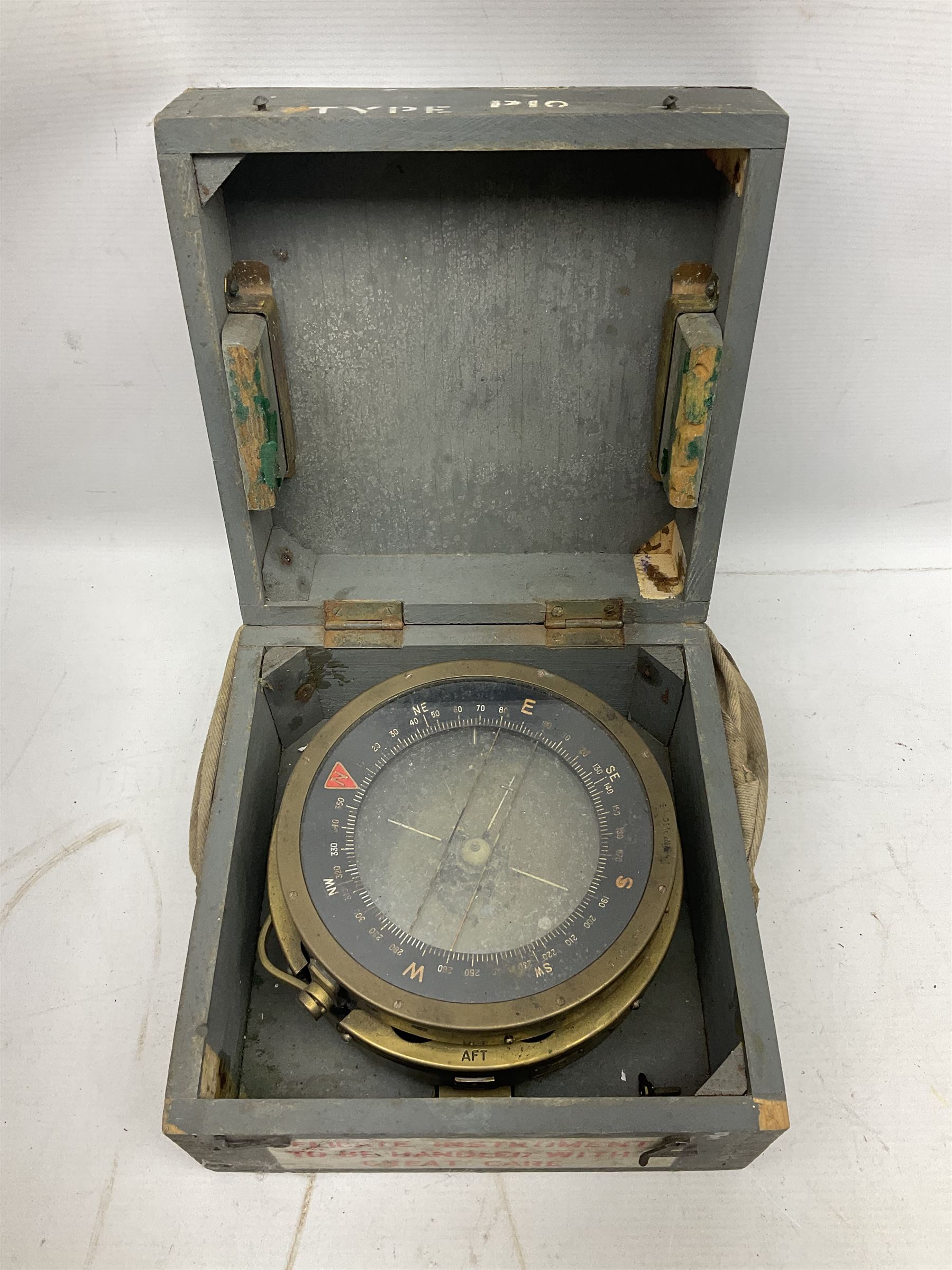  WWII period Type P10 aircraft compass, 16.5cm diameter brass rim marked “Type P10” and “No 1130B”, spring mounted onto brass base with Air Ministry plate marked “Crown A.M. No 6A.1671”; in original grey painted wooden box