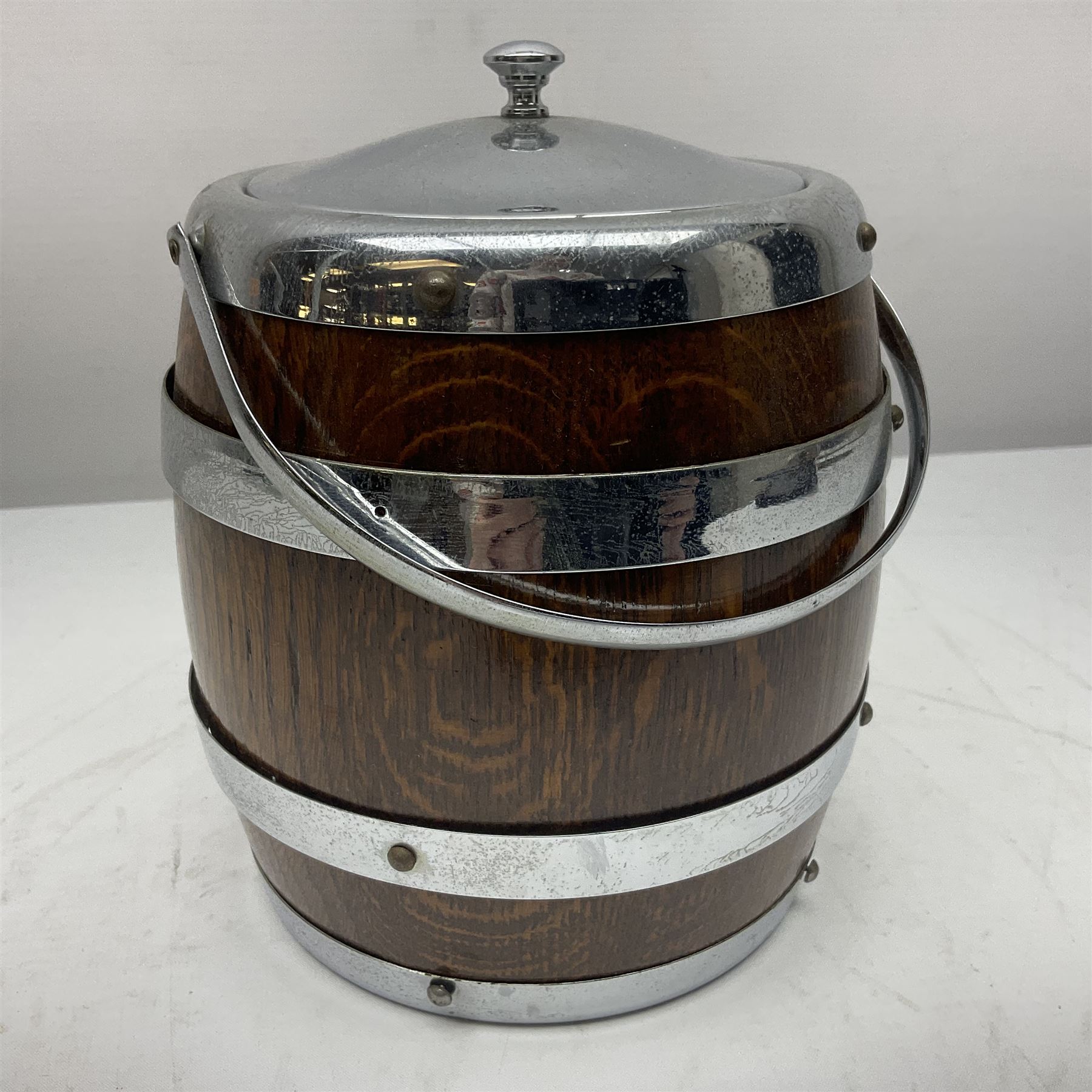 Five early 20th century biscuit barrels with silver-plated mounts