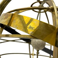 19th century brass terrestrial armillary sphere on rosewood base, lobe carved column on three splayed supports with scrolled carved terminals, the supports united by circular compass with turned stretchers