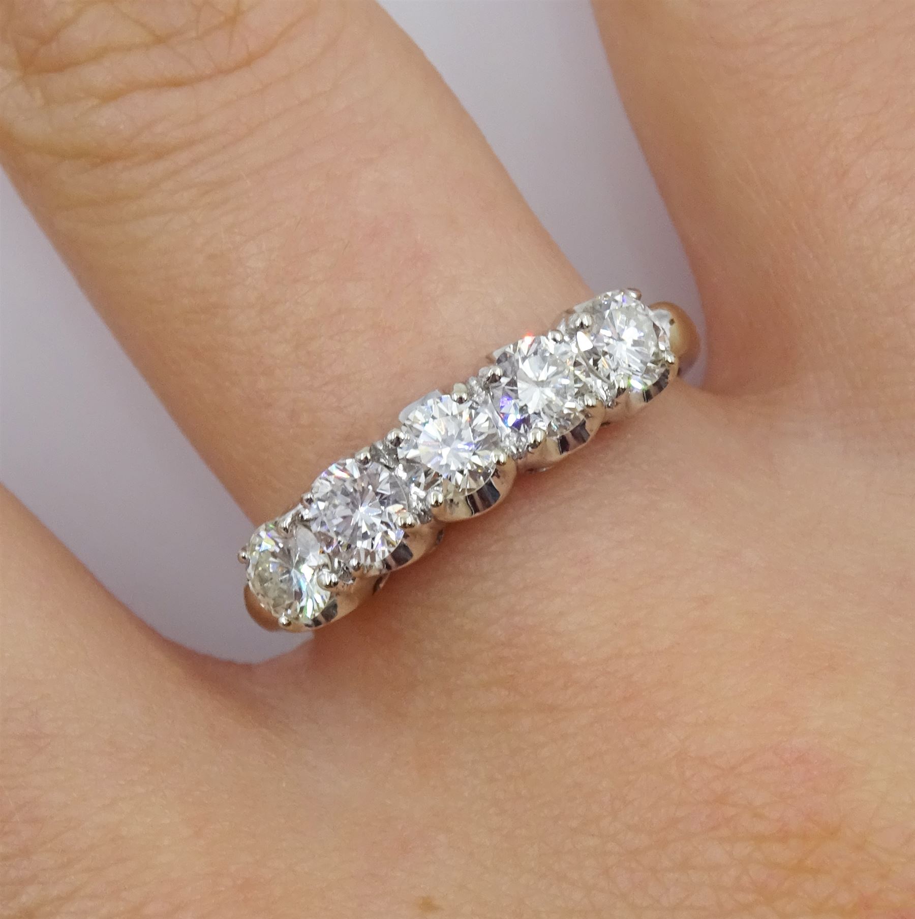 American white gold five stone diamond ring, stamped 14K by Balco Diamonds, Beverly Hills, total diamond weight 1.05 carat, with Ballreich & Co insurance certificate