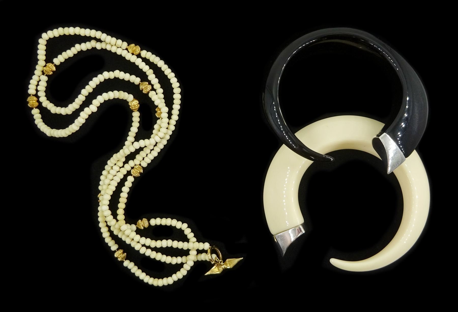 Shaun Leane silver and red topaz ivory resin Tusk bangle, one other black Tusk bangle, both hallmarked and a silver-gilt bone bead wrap bracelet, all by the same hand