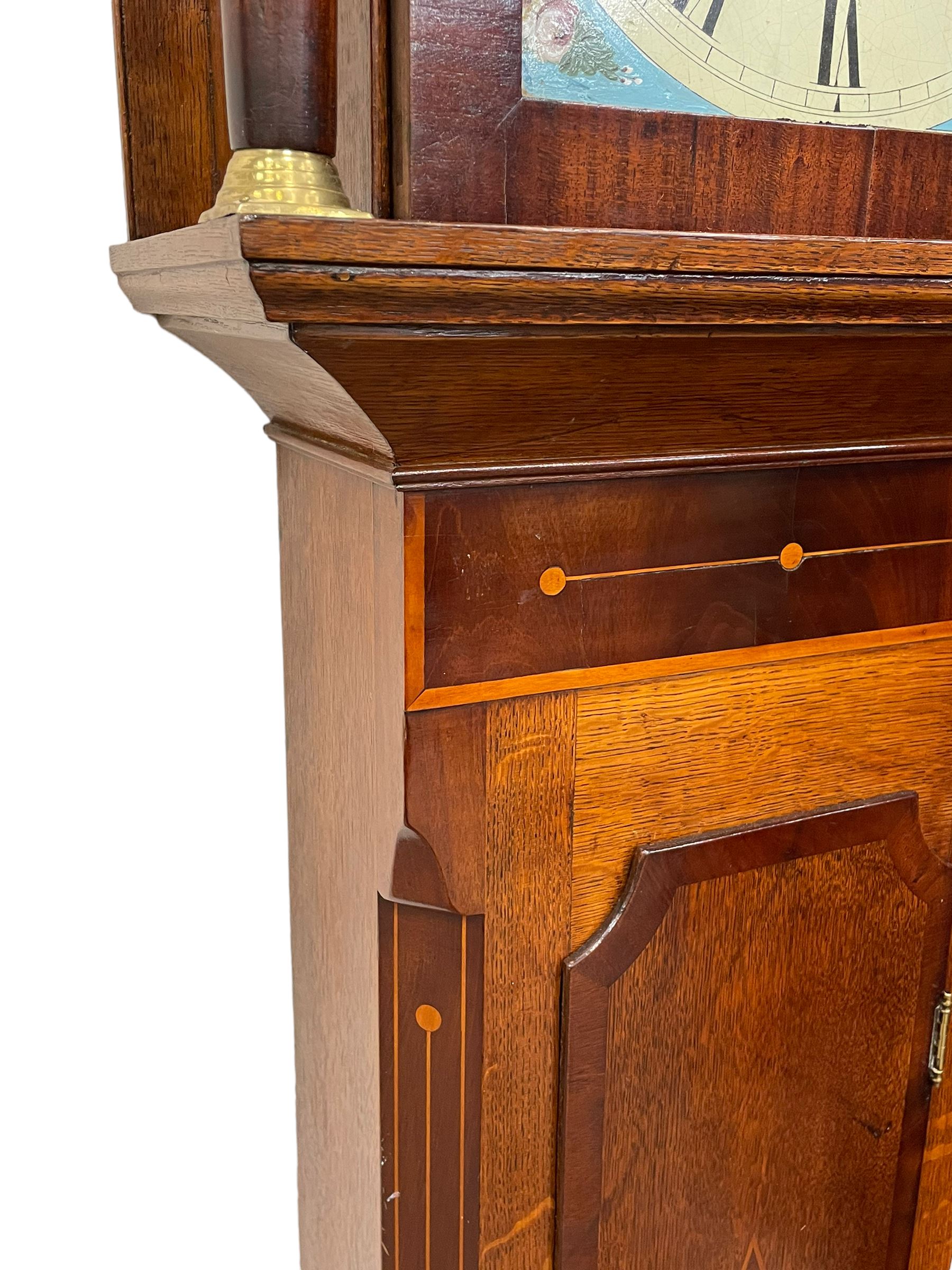 Musson of Louth - mid-19th century oak and mahogany 8-day longcase clock, with a swan’s neck pediment and ball and spire brass finial, break arch hood door flanked by reeded pilasters with brass capitals, canted angled trunk, flat topped door with concave corners, rectangular plinth on bracket feet, fully painted break arch dial with Roman numerals and minute track, subsidiary seconds dial and calendar aperture, matching stamped brass hands, eight day rack striking movement with anchor escapement. With weights and pendulum.
H206 W44 D23
Balthazar Musson from Baden (Germany) is recorded as working in Louth from 1835, naturalised 1861-8. Succeeded by his son, George Balthazar 1872-1920. 
