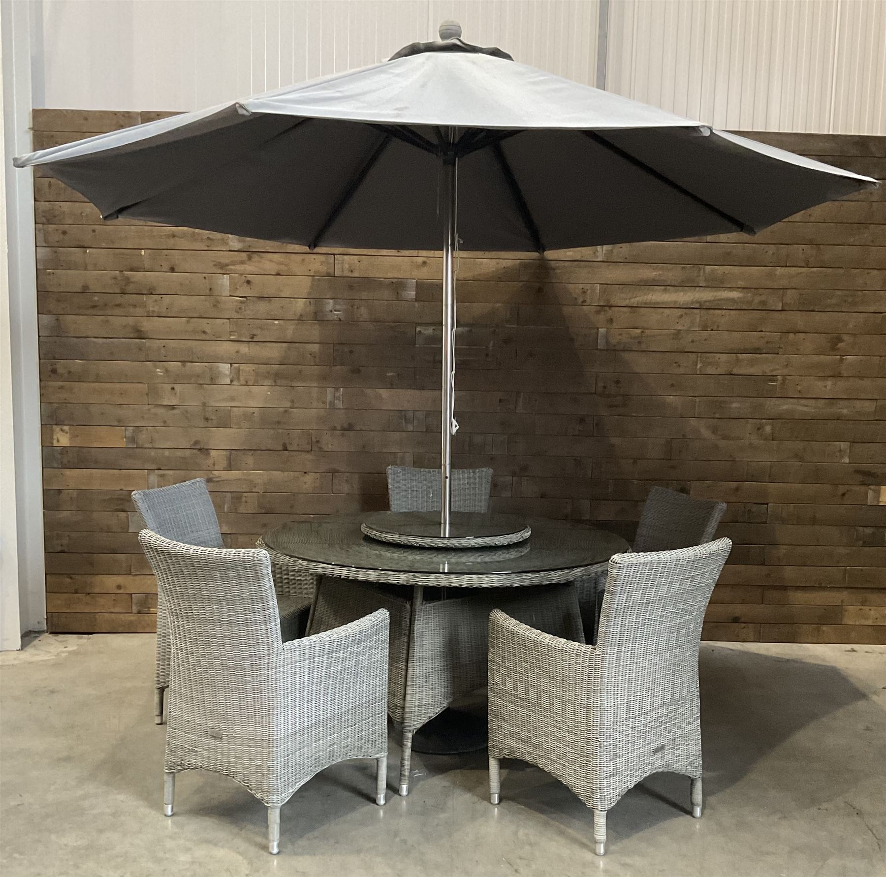 LeisureGrow circular rattan garden table, with lazy Susan, five armchairs with cushions, parasol and weighted base, with glass tops
