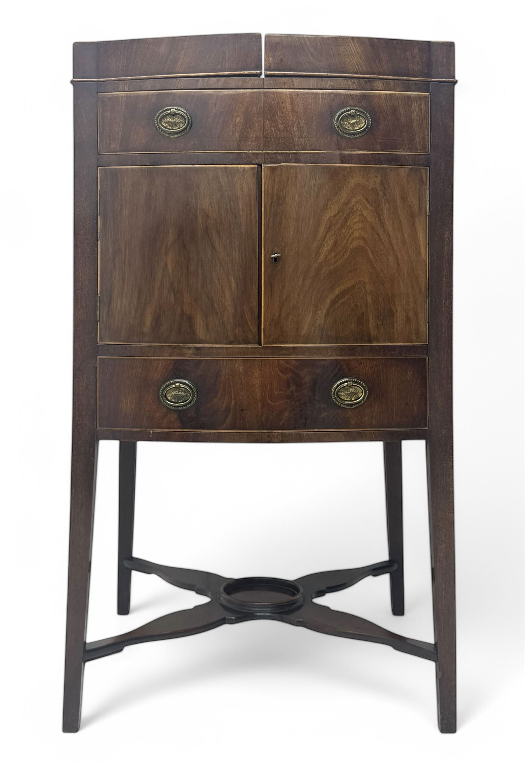 Part canteen of silver plated cutlery, including ivorine handled table and dessert knives, table forks, dessert forks, dessert spoons, teaspoons and soup spoons, all contained within a canteen cabinet converted from a George III mahogany enclosed wash stand