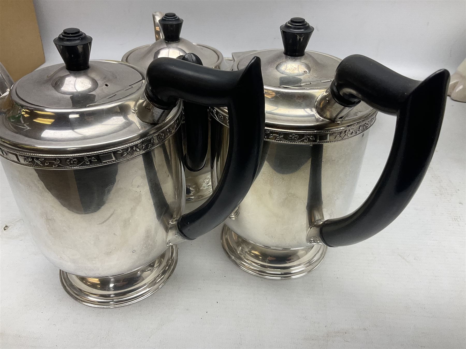 Viners of Sheffield silver-plate tea/coffee wares, the rims decorated with bands of flowers, and chased oval tray with swag decorated gallery, L39cm