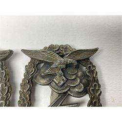 Two WW2 German Luftwaffe Ground Assault/Combat badges - one with flat pin and maker's mark M.u.K.; the other unmarked with round pin (2)