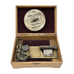 Victorian rectangular disc music box, the hinged lid with printed decoration of a young girl lifting to reveal a brass plate with single comb movement, with six discs, housed in pine case