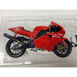 Four Minichamps 1:12 scale die-cast motorcycles - Honda RC211V Team Movistar Honda MotoGP Rider Marco Melandri MotoGP 2005; Yamaha YZR-M1 Antena 3 Yamaha D'Antin Shinya Nakano MotoGP 2003; Yamaha YZR-M1 Max Biaggi MotoGP 2002; and Ducatti 999FO4 Gregorio Lavilla BSB 2005; all boxed (4)