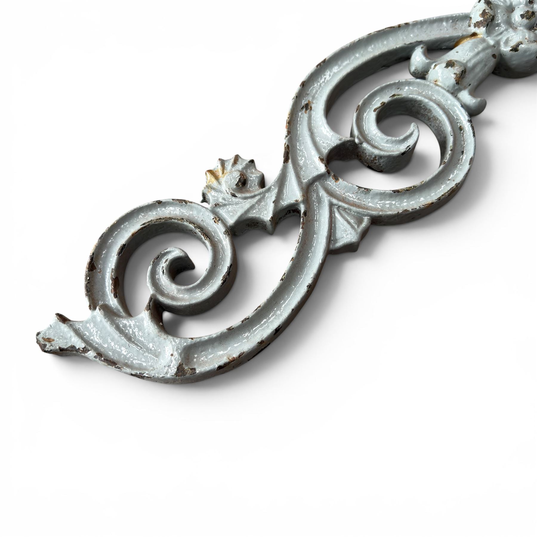 Set of eleven 19th century cast iron ornate stair or banister spindle supports, of scrolling form with scalloped decoration and flower-head motifs, in weathered duck-egg blue painted finish (11)