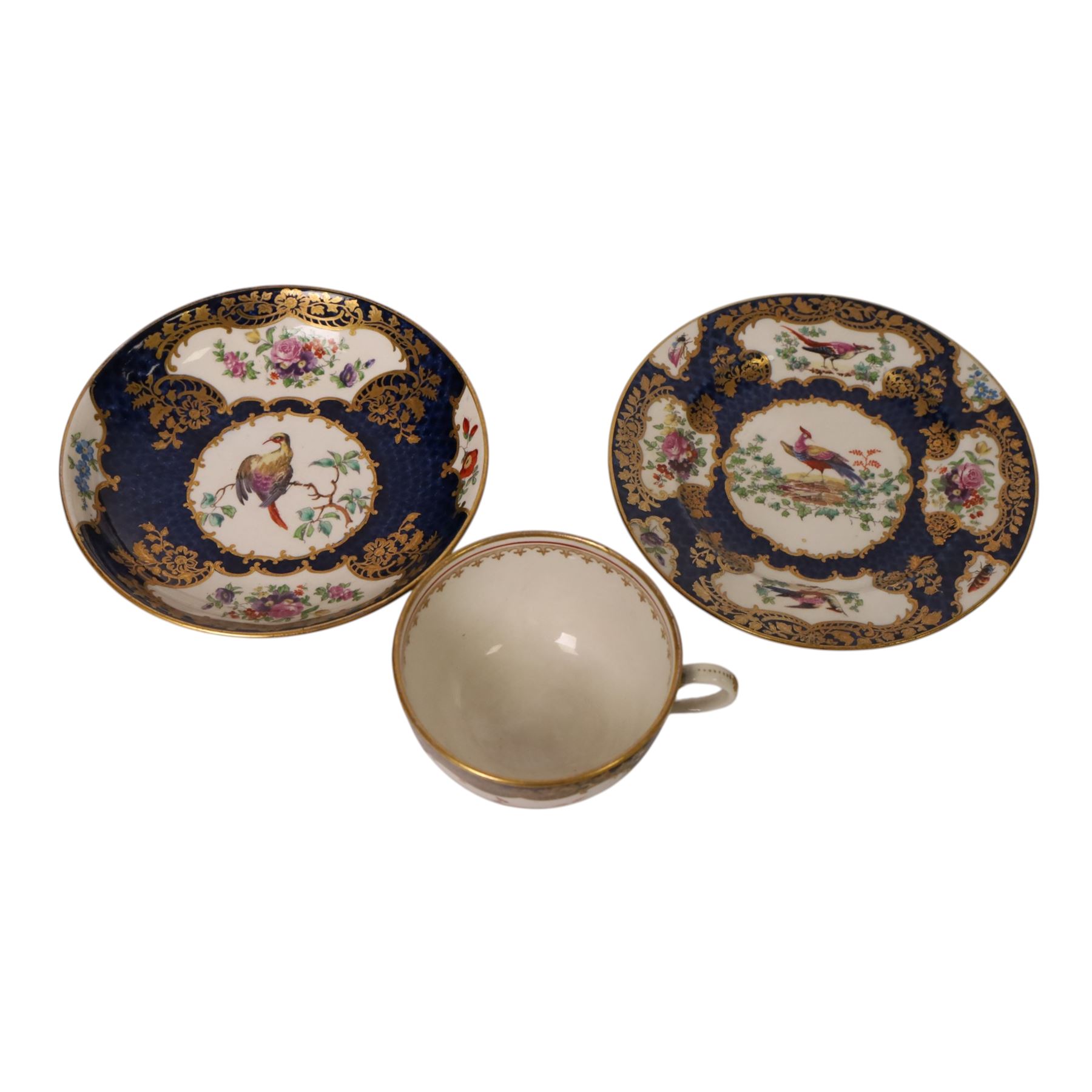18th century Worcester trio, circa 1770,  painted with shaped panels of birds within a gilt boarder upon a blue scale ground with gilt detail to the rim, mark beneath, H7cm 