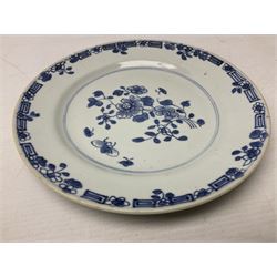 Three Chinese blue and white plates, comprising plate decorated with stylised garden scene with flowers to the centre, bordered with band painted with foliage, grapes and bamboo, together with a pair of blue and white plates each painted with a floral sprig and foliage with insects within foliate and key fret style border, largest D22cm