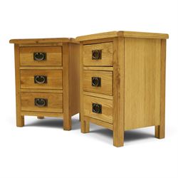 Pair of solid light oak bedside chests, rectangular top over three graduating drawers with metal handles and plates, on square feet