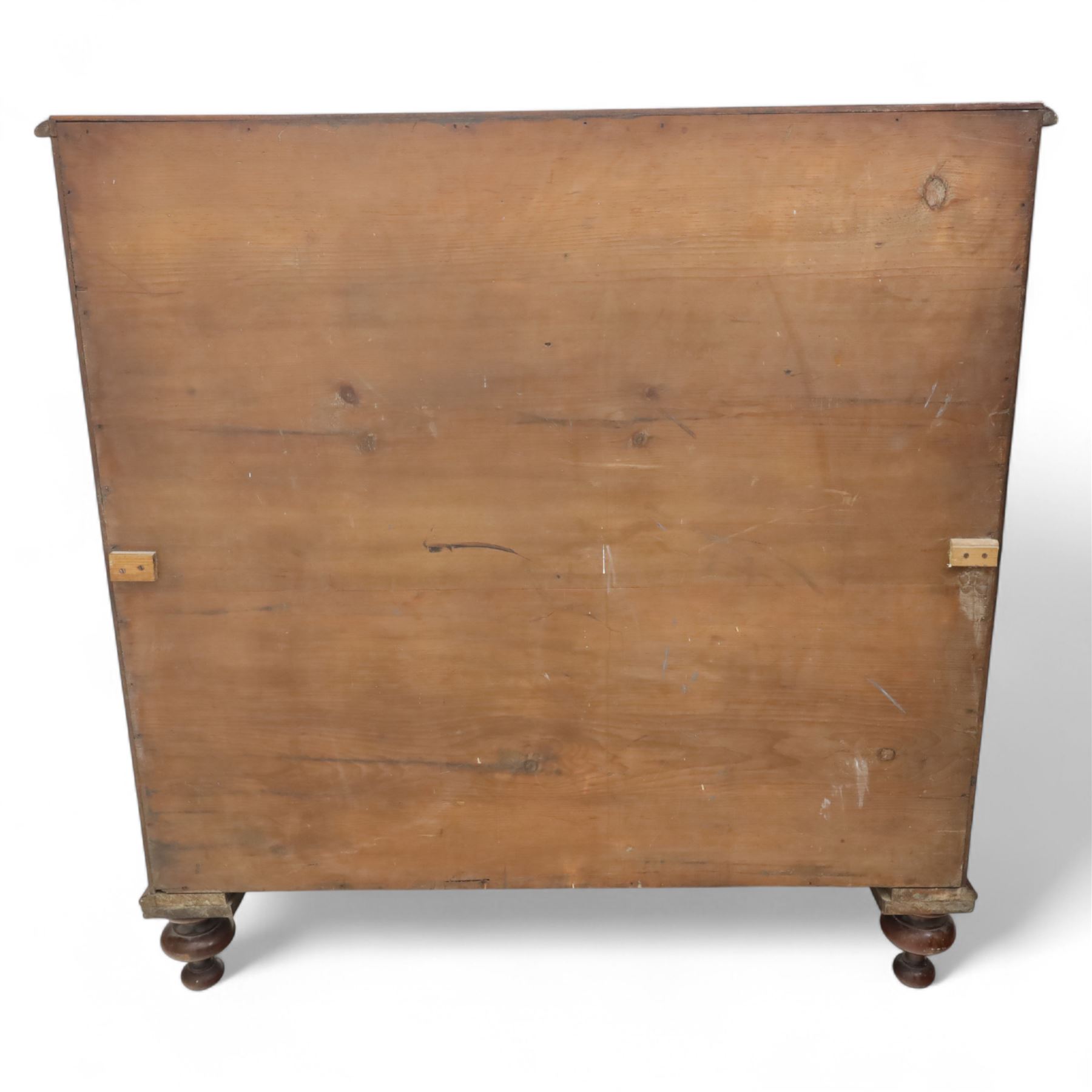 Victorian flamed mahogany chest, fitted with two short and three long drawers, turned wooden handles, raised on bun feet