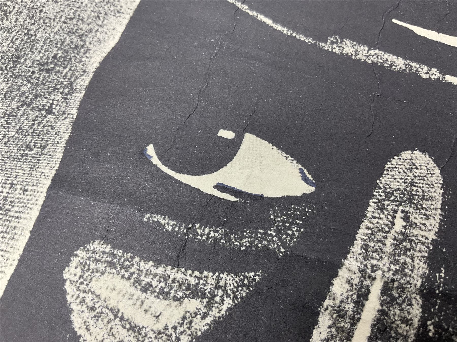 German monochrome 'Gestapo' poster, probably post-WW2, depicting the head of a grim faced Gestapo officer in uniform 55 x 42cm; unframed