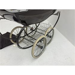 Pair of 1980s Silver Cross brown coach built dolls prams; each with folding canopy and apron, tubular framework with suspension, spoked wheels with brake and luggage rack and separate matching shopping bag L93cm