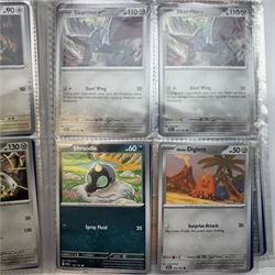 Collection of modern Pokemon TCG trading cards from the Scarlet & Violet and Sword & Shield eras, contained within in two folders, opened packets and loose, together with a graded Sword & Shield Silver Tempest Passiman TG08, GET Graded 9 Mint, two oversized cards, energy cards, vintage booklets and boxes, empty tins, 1998 Electronic Pokédex and other accessories