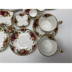 Royal Albert Country Roses pattern part tea and dinner service, to include teapot, four cups and saucers, four dessert plates, cake plate etc, (41)