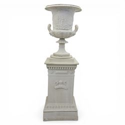 Pair of composite campana urns on stands, the urns decorated with relief figural panels and foliate bands with scrolling handles, on circular socles, the pedestals of square tapering form with moulded edges and applied classical motifs