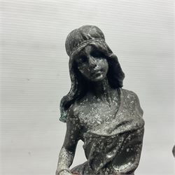 Two bronzed figures, the first modelled as a woman in chains, the second semi nude female with her arms raised above her head, largest H42cm