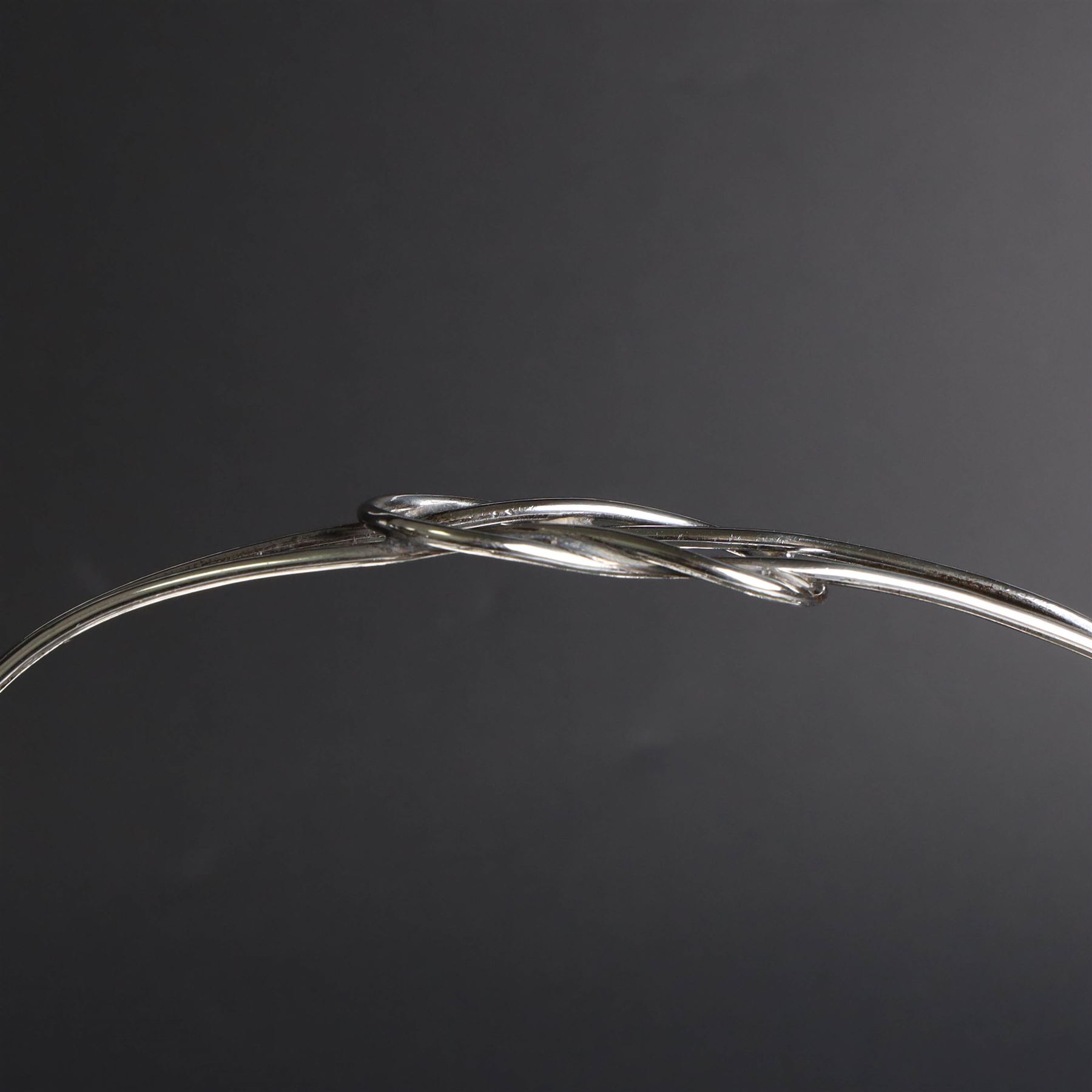 Edwardian silver swing handled basket, of circular form with shaped rim and engraved floral and foliate decoration, with know design swing handle and upon circular stepped pedestal, hallmarked J Sherwood & Sons, Birmingham 1901, H9cm, D22cm