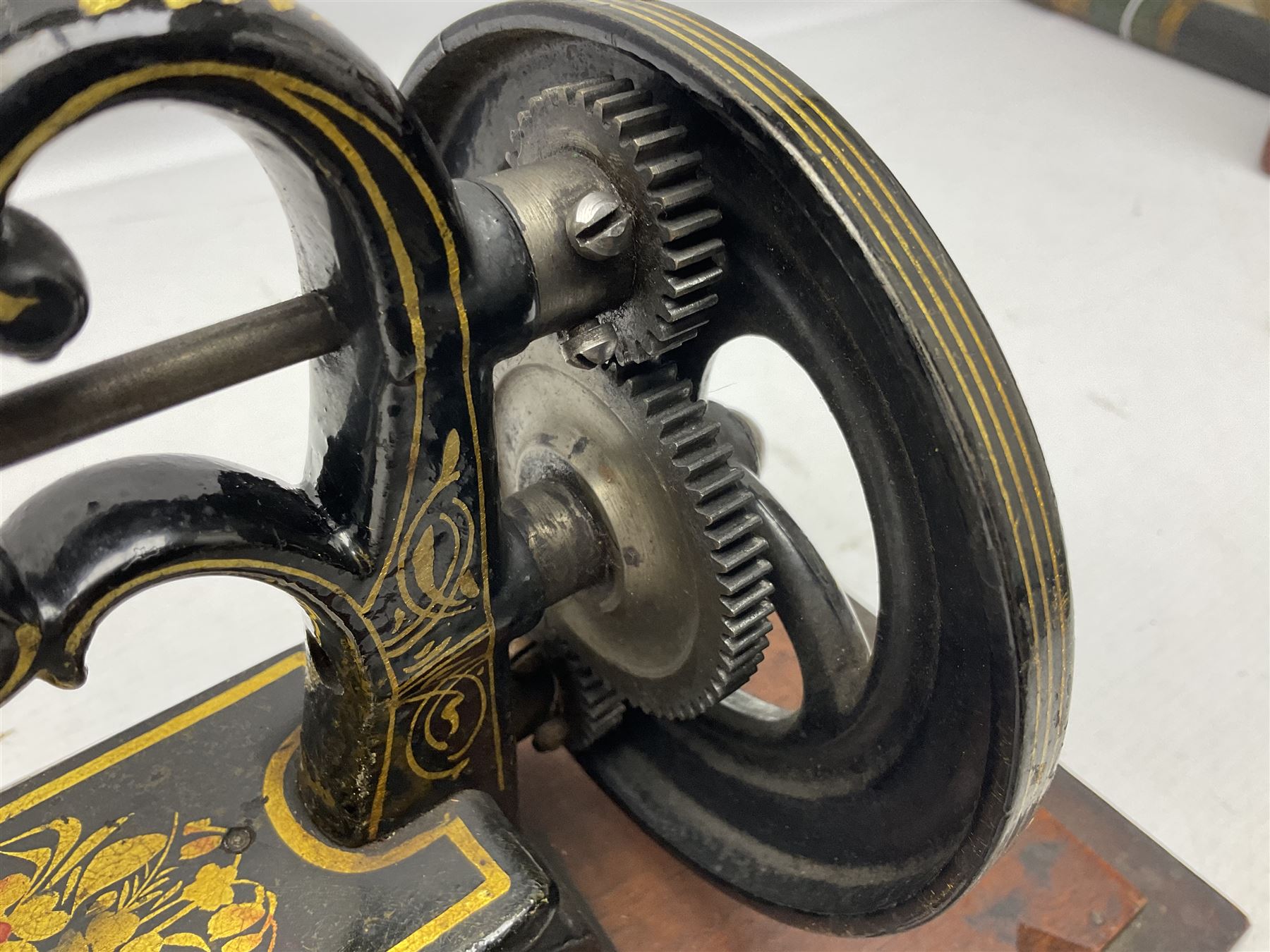 James G Weir 'The Globe' hand-cranked sewing machine, circa 1872, in black finish with gilt and flower painted decoration, the bed stamped Ja's G. Weir, 2 Carlisle Street, Soho Sq., London, with walnut locking carrying case and original manual, boxed H25cm 