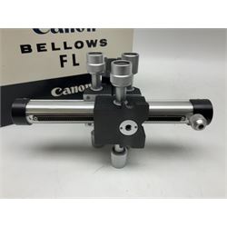 Collection of Canon lenses, to include 'Canon Lens FD 100mm 1:2.8', serial no 12821, 'Canon Lens FD 200mm 1:4' serial no 245313, 'Macro Canon Lens FL 50mm 1:3.5', serial no. 25505, 'Canon Lens FD 135mm 1:3.5 etc, together with other Canon equipment, including Bellows FL, Slide Duplicator etc 