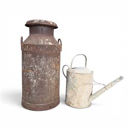 19th century milk churn with weathered patina along with aluminium watering can