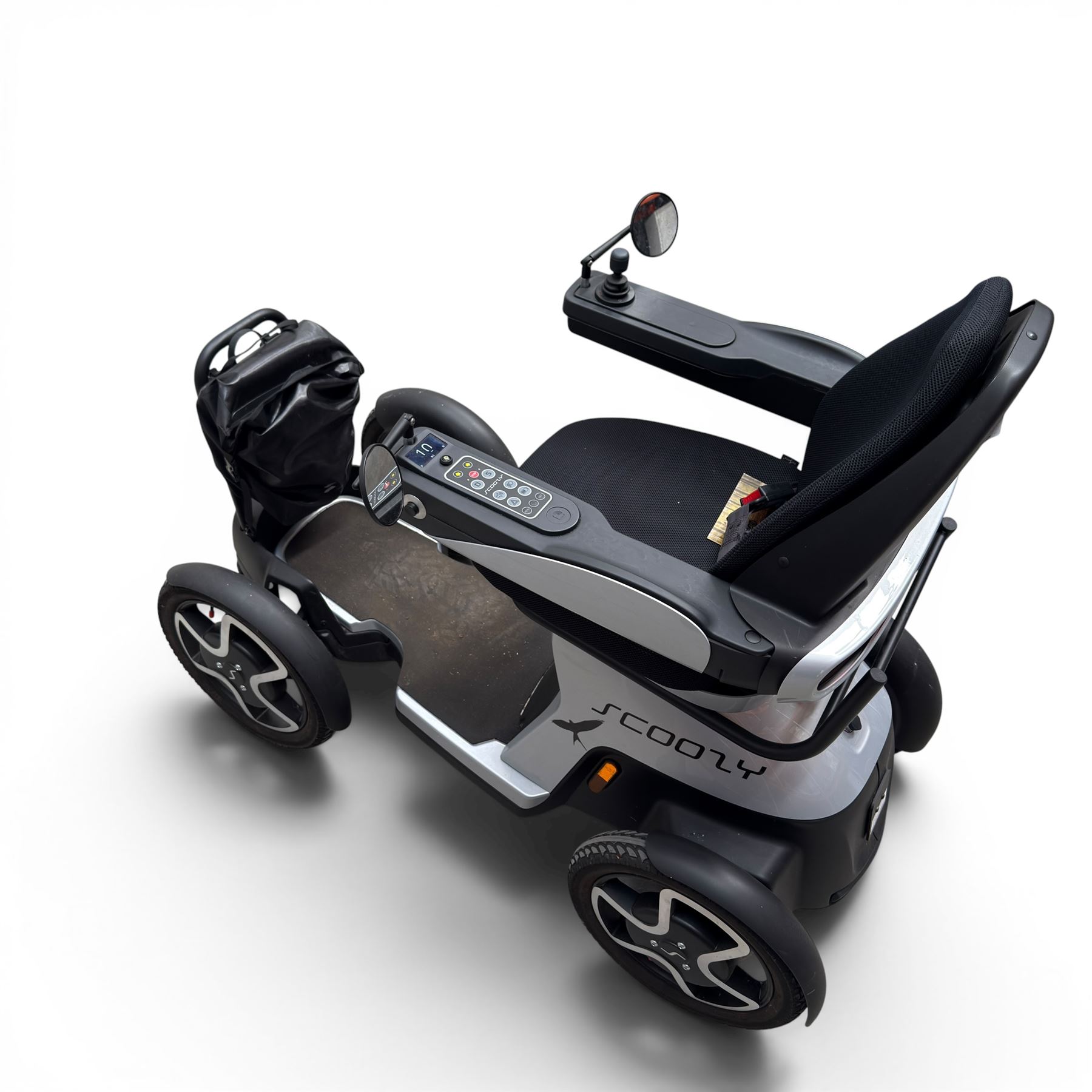 TGA Scoozy - mobility scooter, four wheel model with joystick controls, front storage bag, lights and grey and black bodywork.
