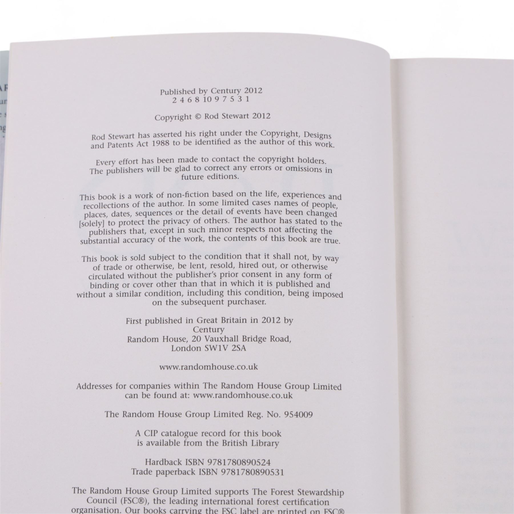 Signed bottle of Rod Stewart edition Wolfie's blended scotch whisky, together with Rod Stewart memorabilia, including first edition of his autobiography, colour photograph and two 7 inch singles