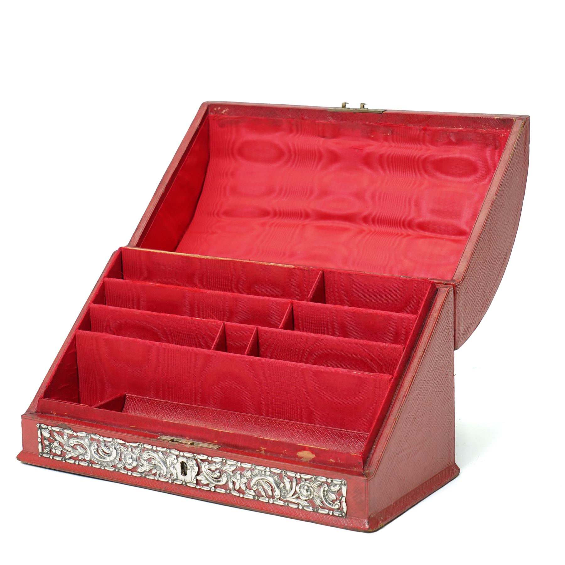 Late Victorian red leather stationery casket with divided watered silk interior, the hinged front with repousse silver mounts H19cm x W30cm London 1889 Maker William Comyns