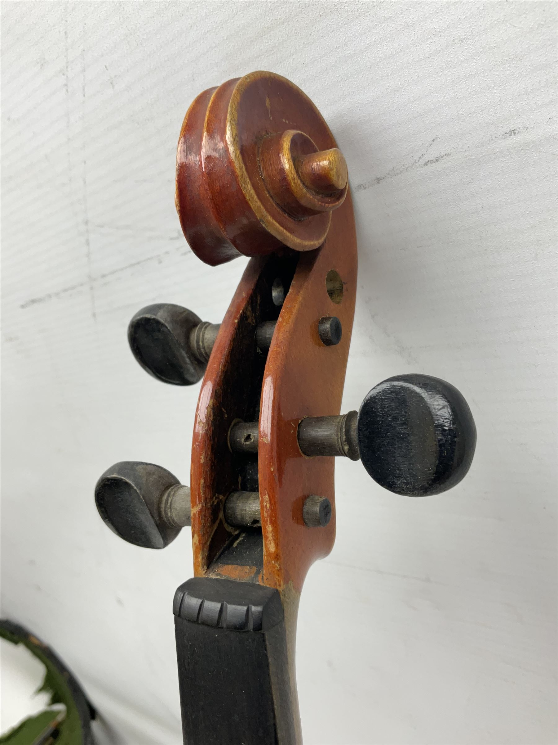 Czechoslovakian violin c1920 with 36cm two-piece maple back and ribs and spruce top, bears label 'Copy of Antonius Stradivarius Made in Czechoslovakia' L59cm; in carrying case; 1950s Czechoslovakian violin; and 195os Czechoslovakian three-quarter size violin; both cased (3)