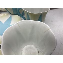 Shelley Dainty pattern tea wares, of lobed form with blue star decoration on merging white and yellow ground, comprising five teacups, five saucers, six tea plates, milk jug and cake plate, all with printed green mark beneath, some with painted pattern no 11770