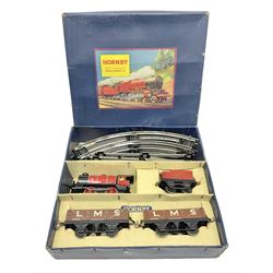 Hornby '0' gauge - 1950s M1 Goods Set box containing clockwork 0-4-0 steam locomotive and matching tender No.3435 with brake, forward and reverse lever and key, together with two 4-wheel LMS open goods wagons and oval of curved and straight tin-plate track and connectors; boxed with illustrated lid