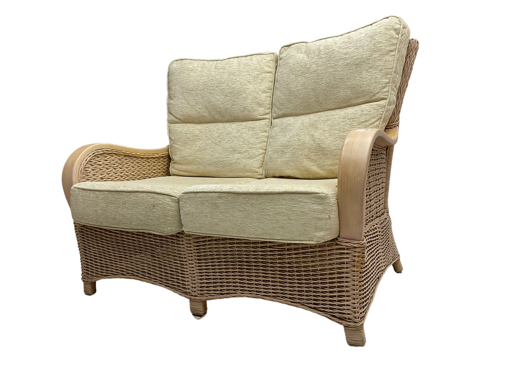 Contemporary rattan conservatory suite - two seat sofa with wicker frame and loose cushions upholstered in textured champagne fabric (W125cm H98cm); pair of matching armchairs (W72cm H98cm); rectangular glass-topped coffee table with rattan frame and undertier (W85cm D60cm H47cm); and matching square side table (W53cm H55cm)