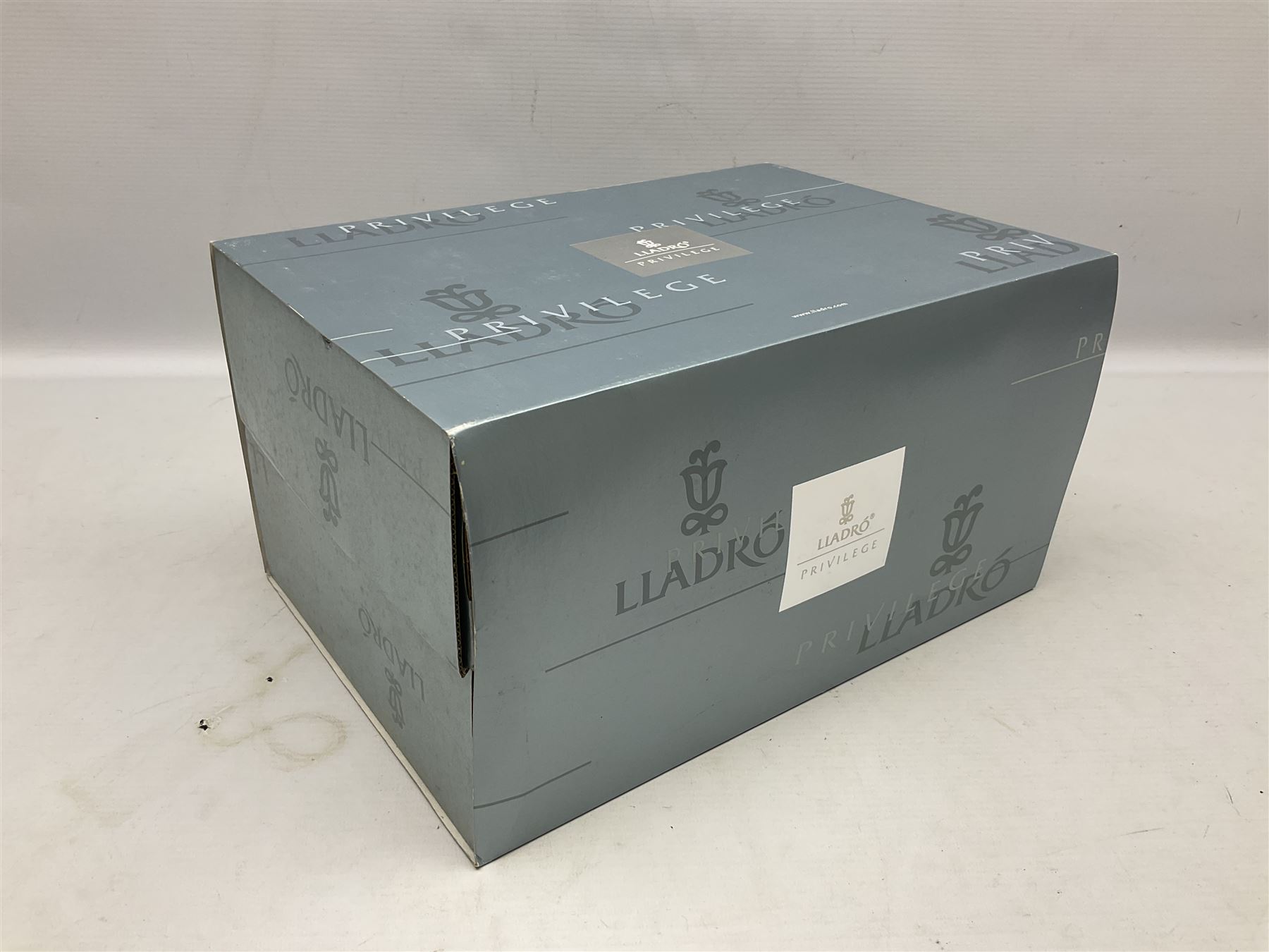 Lladro Privilege figure, Prince of Elves, modelled as an elf with wings leaning upon a rock, with original box, no 7690, sculpted by Joan Coderch, year issue 2001, year retired 2003, H23cm