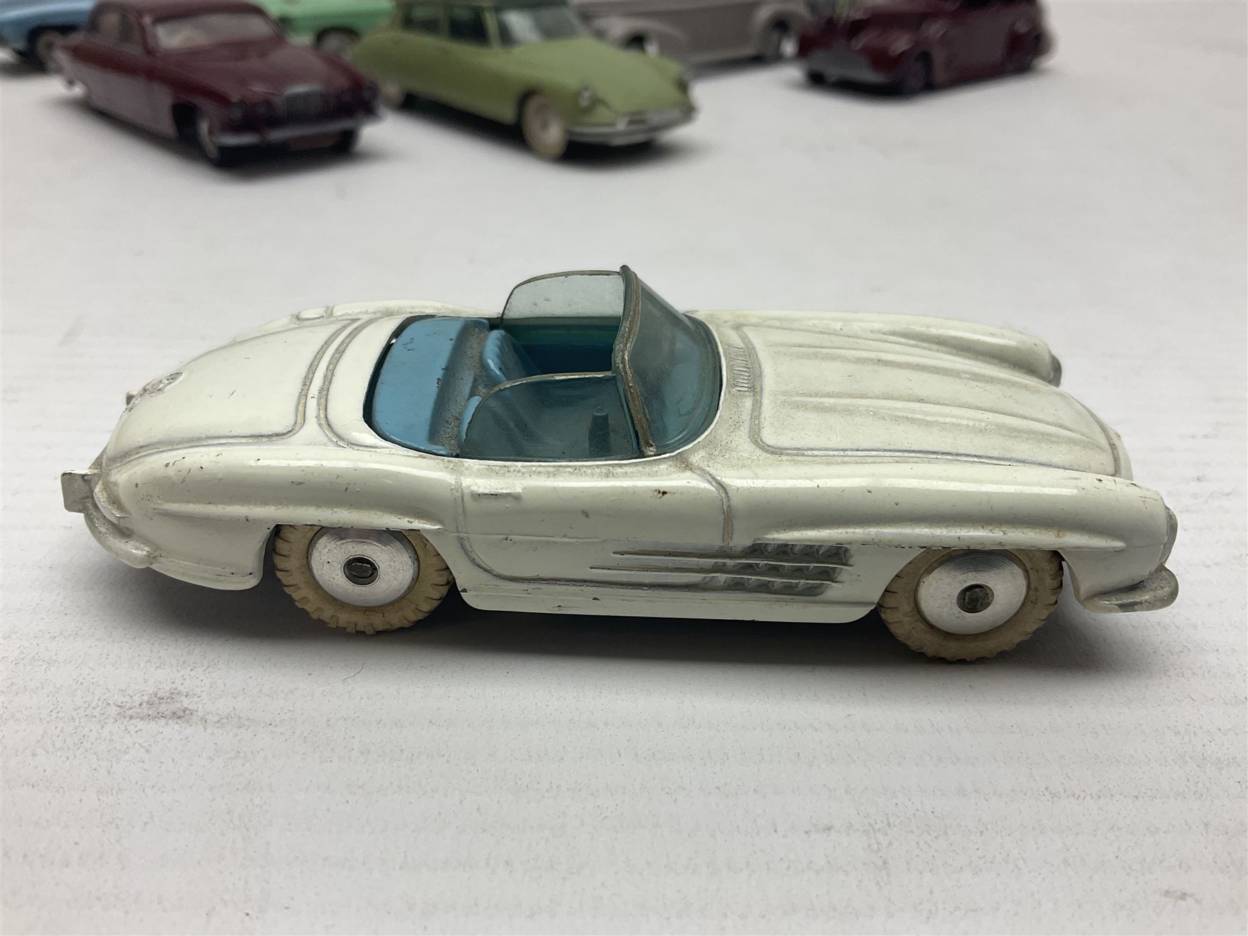 Eleven unboxed and playworn early die-cast models including Dinky Packard, Buick, two Jaguar Mark X and estate wagon, Corgi Mercedes-Benz 300S.L. Roadster, Ford Thunderbird, Citroen DS19 and Bentley Continental Sports Saloon, Spot-On Armstrong Siddeley Sapphire etc; all unboxed (11)