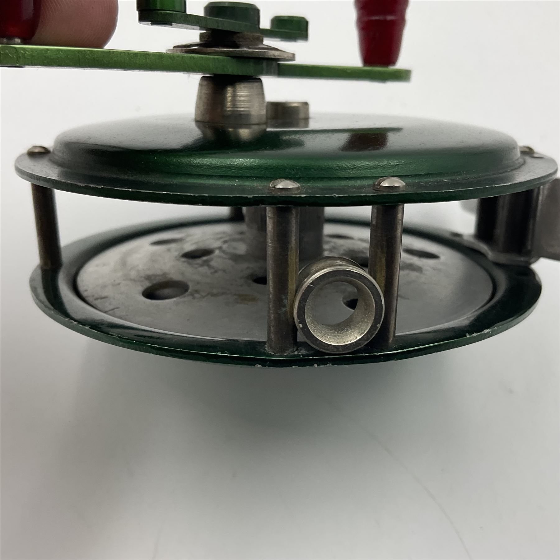 TO RTV Three fishing reels, including American Pflueger progress bulldog size 60 brass and chrome skeleton fly reel, with wooden handle; Maginot 106 fly reel and an alloy reel (3)